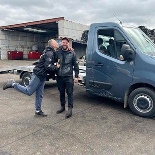 Jamie giving Lukasz key to new truck